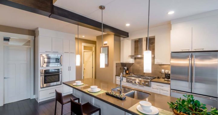 Modern, bright, clean, kitchen interior with stainless steel app